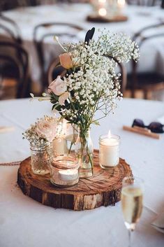 a table with candles and flowers on it