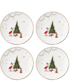 four plates with christmas trees on them