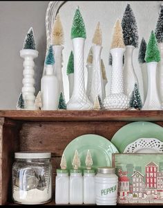 a shelf filled with christmas decorations and dishes