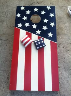 an american flag themed cornhole game on the ground