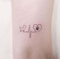 a small heartbeat tattoo with a dog and heart on the right side of the arm