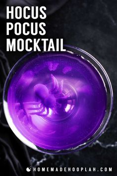 a purple drink in a glass with the words hoccus pocus mocktail