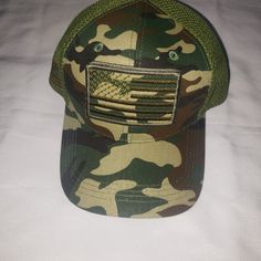 Show Off Your American Pride With This Usa Baseball Cap. The Hat Features An American Flag And Army Design With A Camouflage Green Color. It Is Made Of Polyester Material With A Canvas Fabric Type And Mesh Back Feature, Making It Perfect For Summer And Outdoor Activities. This Baseball Cap Is Adjustable To Fit Any Head Size And Is Suitable For Casual Wear, Workwear, Or Sports. The Hat Is Designed For Men And Has A Classic Style With A Touch Of Patriotism, Making It An Ideal Accessory For Any Occ Military Style Sports Hat, Camouflage Trucker Hat One Size, Camouflage Trucker Hat One Size Fits Most, Green Military Baseball Cap With Flat Bill, Green Military Style Baseball Cap With Flat Bill, Casual Camouflage Hat With Curved Bill, Camouflage Baseball Cap With Visor, Casual Camouflage Baseball Cap For Sports, Military Style Trucker Hat, One Size Fits Most