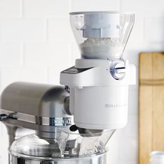 a silver blender sitting on top of a counter