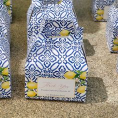 several blue and white boxes with lemons on them