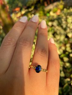 "Oval Cut 7x5 Sapphire Ring, Blue Sapphire Solitaire Ring, Chain Shaped Band, September Birthstone Ring, Gemstone Ring, Anniversary Gift for her Product Details ✿Made to Order ✿Gold Color : Available in Yellow Gold, White Gold, Rose Gold ✿Gold Kt : 14K ( also available in 18k) ✿Gemstone : Blue Sapphire ✿Size of Sapphire : 7 x 5 ✿Sapphire Ct : 1 ct ✿Setting Type : Prong Setting ✿Band Width: 2.40 mm ✿Band Height: 1.40 mm ---- PRODUCTION TIME ---- This ring will be made for you and ready to be ship Fine Jewelry Gold Ring With Lab-created Sapphire, Gold Jewelry With Lab-created Sapphire For Anniversary, 14k Gold Sapphire Jewelry With Prong Setting, Yellow Gold Tanzanite Jewelry In Round Cut, Anniversary Yellow Gold Jewelry With Lab-created Sapphire, Lab-created Sapphire Jewelry In Prong Setting, Gold Round Cut Lab-created Sapphire Jewelry, Gold Jewelry With Round Cut Lab-created Sapphire, Gold Jewelry With Round-cut Lab-created Sapphire