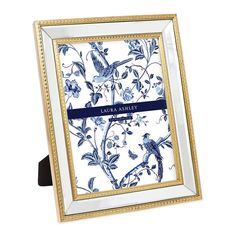 a blue and white frame with flowers on it