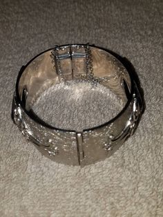 "I will combine shipping on all purchases and refund any overages after shipping fees and insurance. In beautiful vintage condition. Clearly stamped. Fancy ornate design on the silver tone metal with 2 large Hematite stones (one on top and one on bottom) Approximately 7\". Please look at the pictures for details and condition or message me with any questions" Vintage Etched Sterling Silver Bangle Bracelet, Vintage Sterling Silver Hallmarked Bangle, Vintage Hinged Bangle, Vintage Hallmarked Sterling Silver Bangle Bracelet, Vintage Silver Hinged Bangle, Hematite Stone, Butterfly Brooch, Vintage Butterfly, Gold Enamel