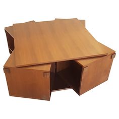 a wooden desk with an open drawer on the bottom and one section missing from it