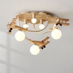 an airplane shaped light fixture hangs from the ceiling