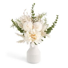 a white vase filled with flowers and greenery