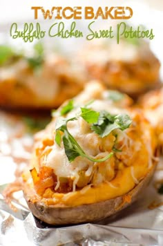 two baked buffalo chicken sweet potatoes on tin foil with text overlay that reads twice baked buffalo chicken sweet potatoes