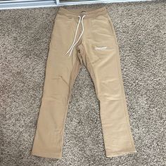 Brand New Never Worn Originally $130+ Slight Flare At Bottom Waist: 14” (Stretchy) Inseam: 30.5” Feel Free To Send Me An Offer! I Will Ship Out The Same Or Next Day Of Purchase! (: Fitted Bottoms With Straight Hem For Streetwear, Beige Tapered Leg Bottoms For Streetwear, Sporty Cream Pants With Pockets, Sporty Beige Straight Leg Bottoms, Fitted Beige Pants For Streetwear, Sporty Beige Streetwear Bottoms, Sporty Beige Trousers, Beige Cotton Athleisure Pants, Stretch Beige Bottoms For Streetwear