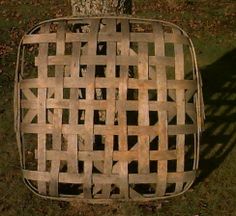 an old wooden chair sitting in the grass