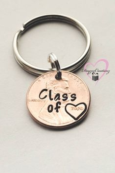 a penny keychain with the words class of 2013 on it and a heart