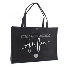 a black tote bag with white writing on the side and a heart in the middle