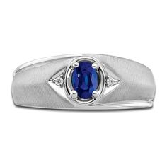 a men's ring with an oval blue sapphire and diamonds on the sides, set in 18k white gold