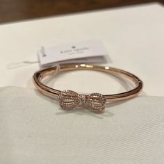 Kate Spade Bangle Bracelet In Rose Gold Tone With Pave, Crystal Stones And A Hinged Clasp. New With Tag And Never Worn. Kate Spade Bangle Bracelet, Jewelry Tattoos, Hinge Bracelet, Kate Spade Bangle, Girl Bracelet, Clothing Jewelry, Jewelry Tattoo, Pretty Jewelry, Hinged Bracelet