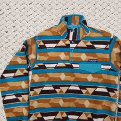 Features: Snap T Neckline. Synchilla Fleece. Lightweight. Warm. Awesome Pattern. Flaws: Light Signs Of Use. Overall This Is In Good Condition With Normal Signs Of Use And Is Ready To Be Used! Patagonia Synchilla, Pullover Fleece, Patagonia Jacket, Patagonia Jackets, Patagonia Womens, Print Pullover, Utility Jacket, Geometric Patterns, Jacket Coat