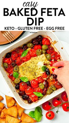 an easy baked feta dip recipe in a casserole dish with olives and tomatoes