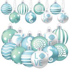 blue and white christmas ornaments with love written in the middle, hanging from strings on a white background