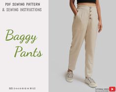 a woman in black shirt and tan pants standing next to an advertisement for baggy pants