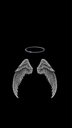 two angel wings with halo on black background