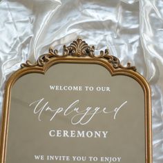 an ornate gold framed mirror with the words welcome to our wedding ceremony