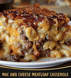 macaroni and cheese meatloaf casserole on a white plate with gold lettering