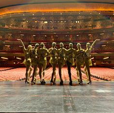 a group of people standing on top of a stage