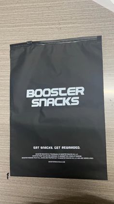 a black bag with the words booster snacks on it