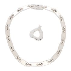 A stylish vintage Cartier 'Fidelity' chain link lock and key bracelet set in 18k white gold. The bracelet is composed of 15 individual polished white gold links which makes the bracelet a perfect contender for everyday wear. What makes this bracelet so unique is the concept and design behind it. The bracelet is fastened with a click shut fitting which require a heart shaped key to unlock and take off. Due to the style this piece would make a perfect piece of everyday jewellery. The bracelet could easily be worn by itself as a stand-alone piece, or alternatively, stacked up amongst other bracelets. The bracelet measures 17.5 centimetres in length and 0.5 centimetres in thickness (The bracelet can be shortened or lengthened upon request). There is a total weight of 19.5 grams and both key an Cartier Jewellery, Key Bracelet, Bracelets Vintage, Everyday Jewellery, Cartier Bracelet, Cartier Jewelry, Bracelets Gold, Jewellery Uk, Gold Bracelets