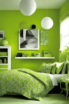 a bedroom with green walls and white furniture