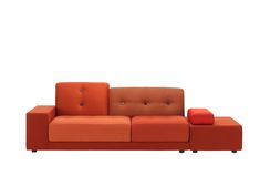 an orange couch sitting on top of a white floor next to a red ottoman chair