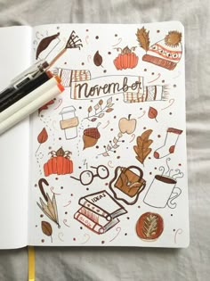 an open notebook with autumn doodles on it