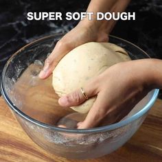 a person kneading dough into a bowl on top of a wooden table with the words super soft dough above it