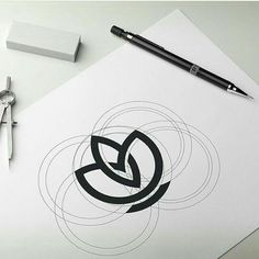 a pen and scissors on top of a piece of paper next to an envelope with the letter b