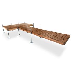 a long wooden bench with metal poles on the bottom and one section missing from it