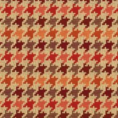 an orange, red and brown houndskin pattern is shown on a beige fabric background