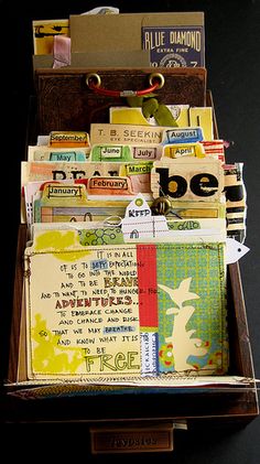 an open suitcase filled with lots of different types of cards and papers on top of each other