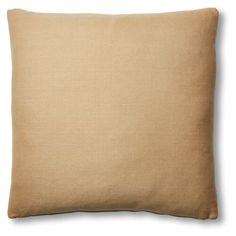 a beige pillow on a white background