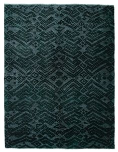 a black rug with an abstract design on the front and back side, in dark green tones