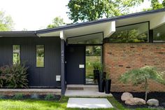 a black and white photo of a modern home