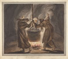 two men in robes are standing over a fire