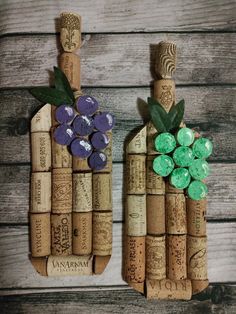 two wine corks with grapes and leaves on them