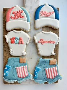 three decorated cookies with hats and shorts