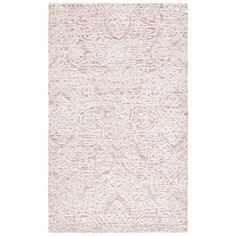 a pink and white rug with an intricate design on the bottom, in front of a white background