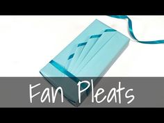 an origami box with blue ribbon and the words fan pleas on it