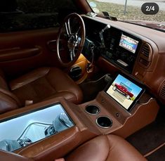 the interior of a car with an electronic tablet