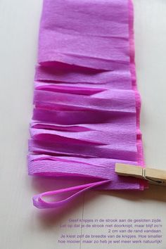 a piece of paper with some pink yarn on it